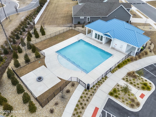 pool featuring a fenced backyard and a patio area