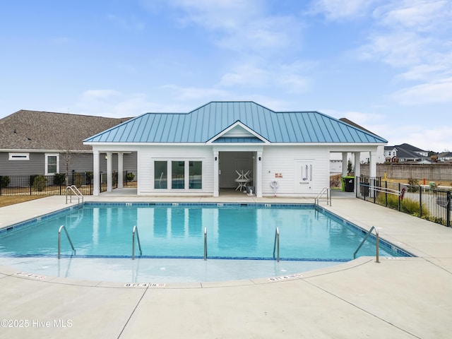 pool featuring a patio and fence