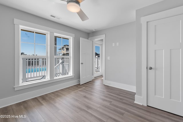 unfurnished room featuring ceiling fan and light hardwood / wood-style floors