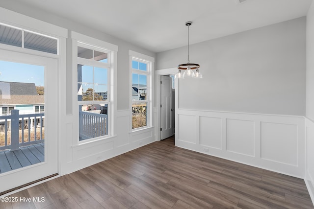 unfurnished dining area with hardwood / wood-style flooring