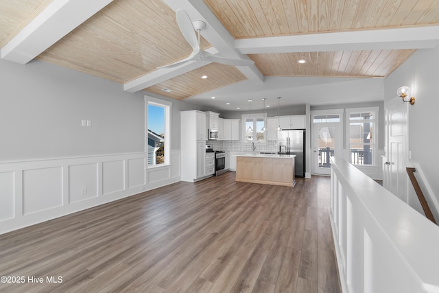 unfurnished living room with wood ceiling, wood-type flooring, and lofted ceiling with beams