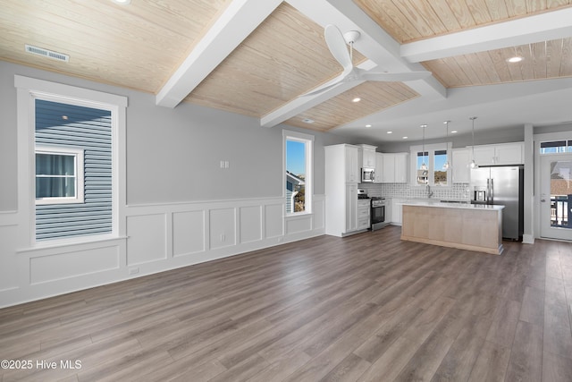 unfurnished living room with wood ceiling, wood-type flooring, and vaulted ceiling with beams