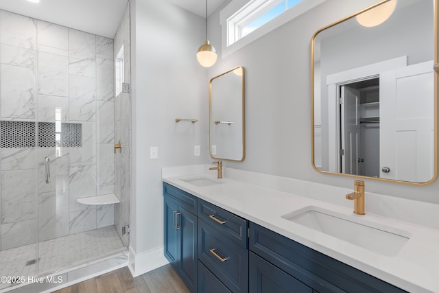 bathroom featuring vanity, hardwood / wood-style floors, and walk in shower