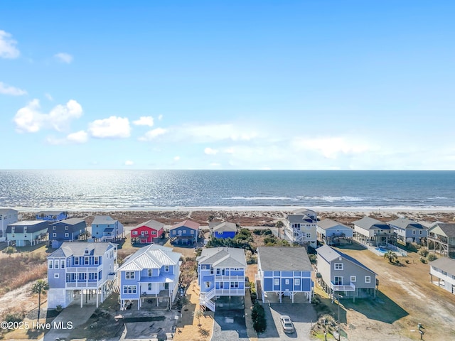 aerial view featuring a water view and a view of the beach