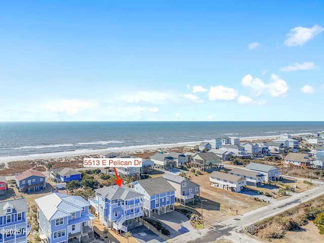 bird's eye view featuring a water view and a view of the beach