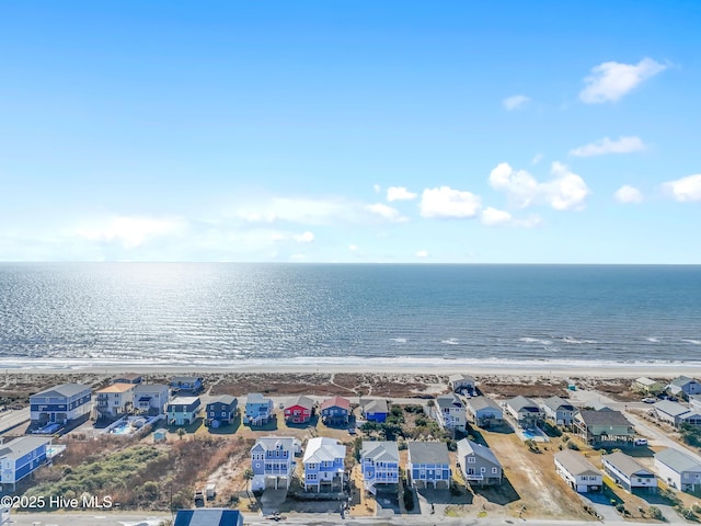 aerial view with a water view and a view of the beach