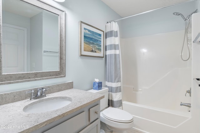 full bathroom featuring shower / tub combo, vanity, and toilet