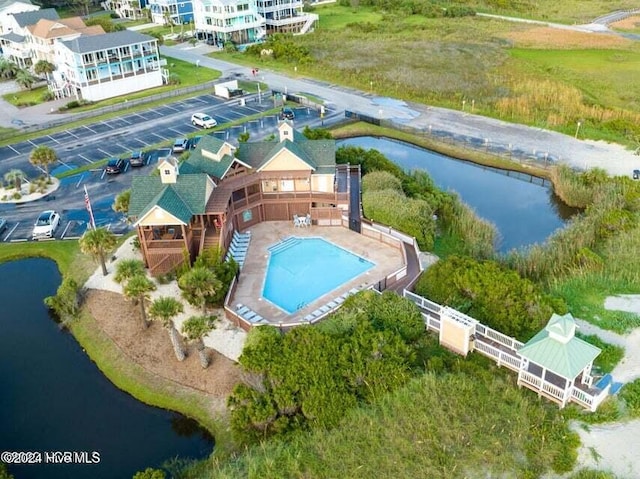 birds eye view of property featuring a water view