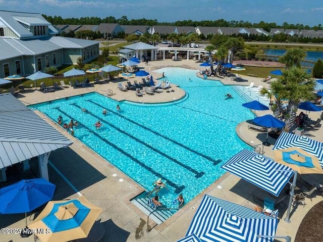 view of swimming pool featuring a patio area