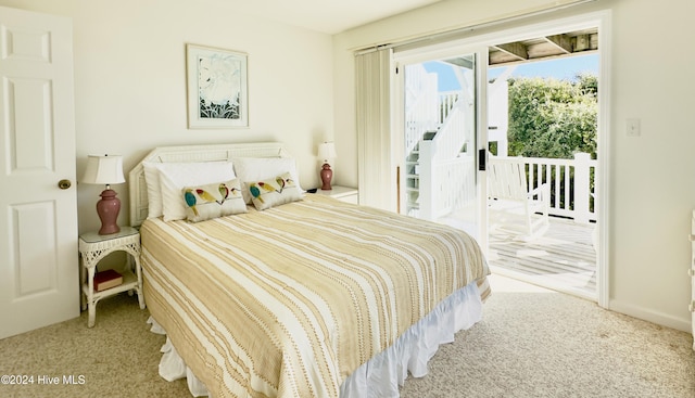 carpeted bedroom with access to exterior