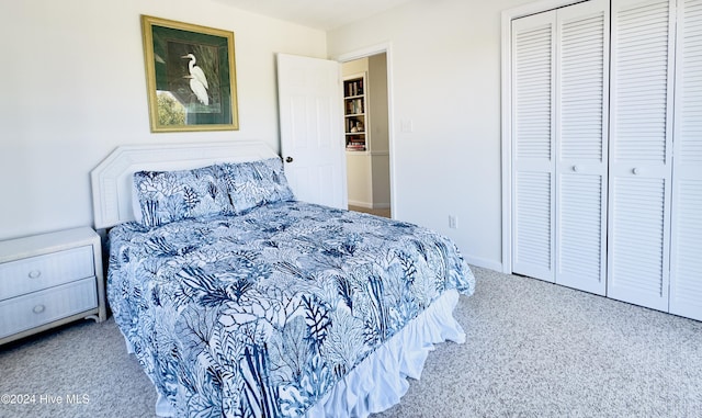 carpeted bedroom featuring a closet