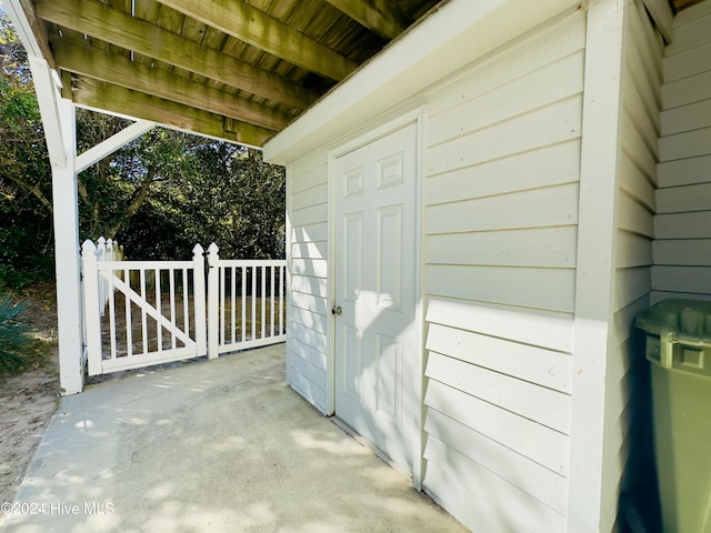 view of side of home featuring a storage unit