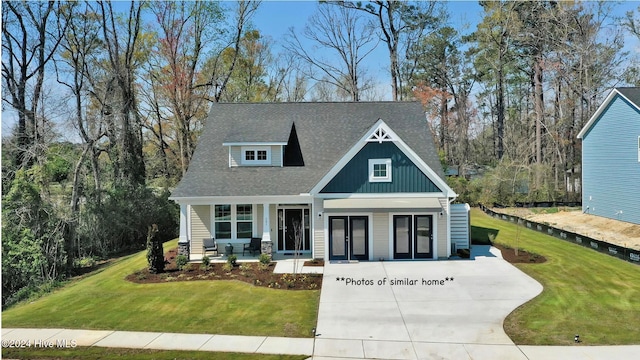 craftsman house with a front lawn and covered porch