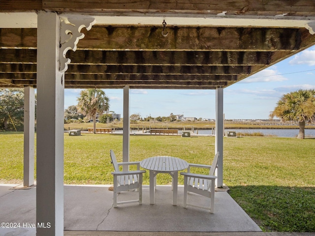 view of patio with a water view