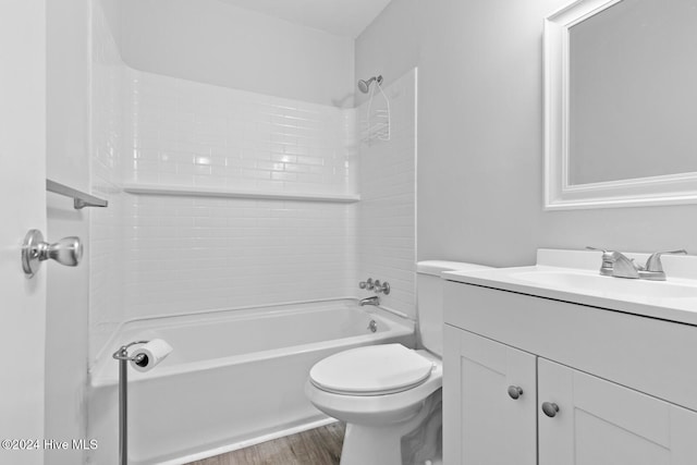 full bathroom featuring vanity, hardwood / wood-style flooring, toilet, and shower / bathtub combination