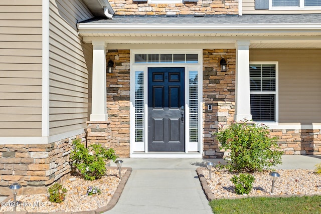 doorway to property featuring a porch