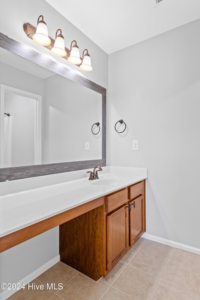 bathroom featuring tile patterned floors and vanity