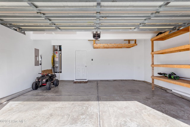 garage featuring electric panel, water heater, and a garage door opener