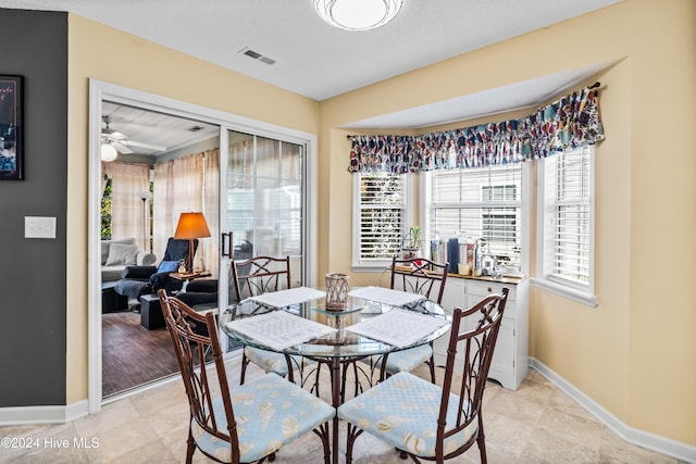 dining room featuring light hardwood / wood-style floors and ceiling fan