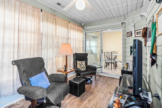 sitting room featuring hardwood / wood-style flooring and ceiling fan