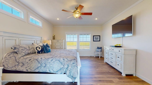 bedroom featuring wood-type flooring, ceiling fan, and crown molding