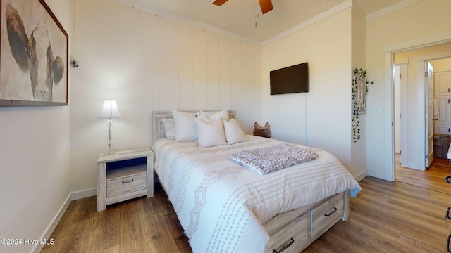 bedroom featuring ornamental molding, dark hardwood / wood-style flooring, and ceiling fan