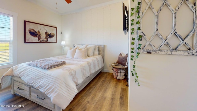 bedroom featuring hardwood / wood-style floors and ceiling fan