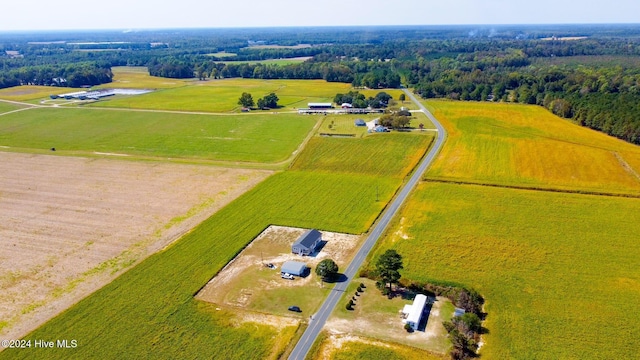 birds eye view of property with a rural view