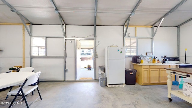 garage with white refrigerator