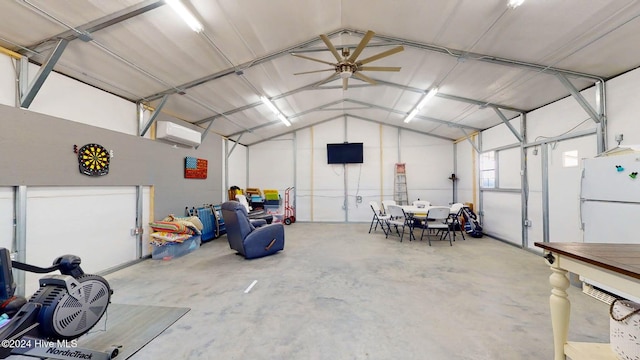 garage featuring an AC wall unit, ceiling fan, and white refrigerator