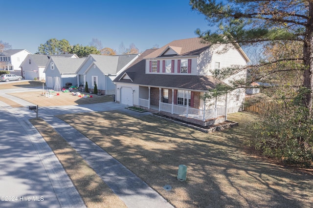 view of front of property with a porch and a garage