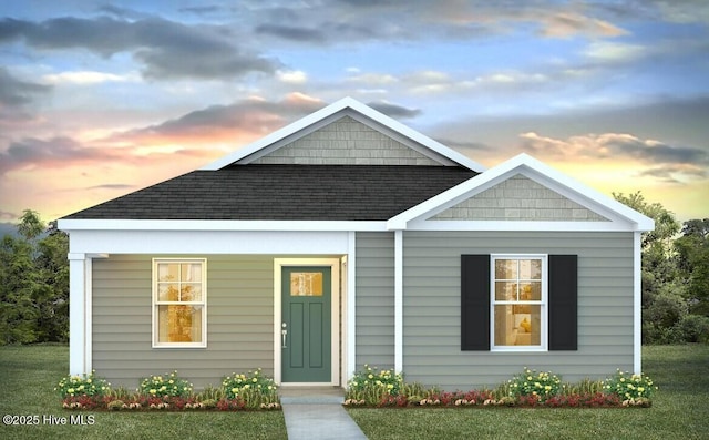 63 N Atlantic Ave Lot 143, Wilmington, NC 28411 - view of front of property with a shingled roof and a front yard