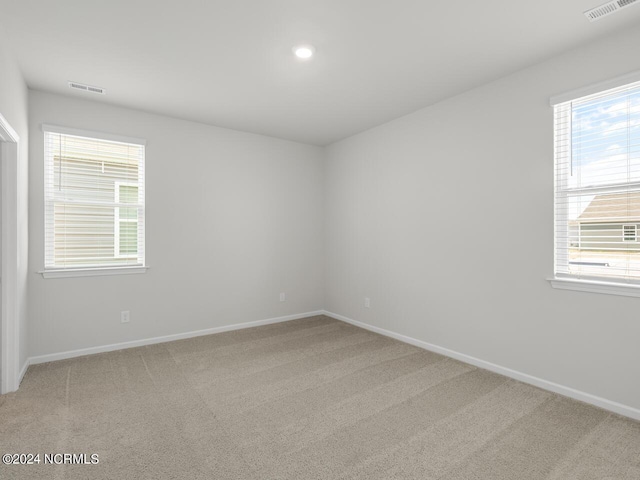 63 N Atlantic Ave Lot 143, Wilmington, NC 28411 - kitchen with white cabinets, light stone counters, a sink, and dark wood finished floors