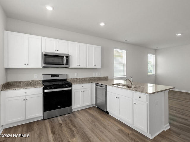 63 N Atlantic Ave Lot 143, Wilmington, NC 28411 - kitchen with light stone countertops, appliances with stainless steel finishes, dark wood-style floors, and baseboards