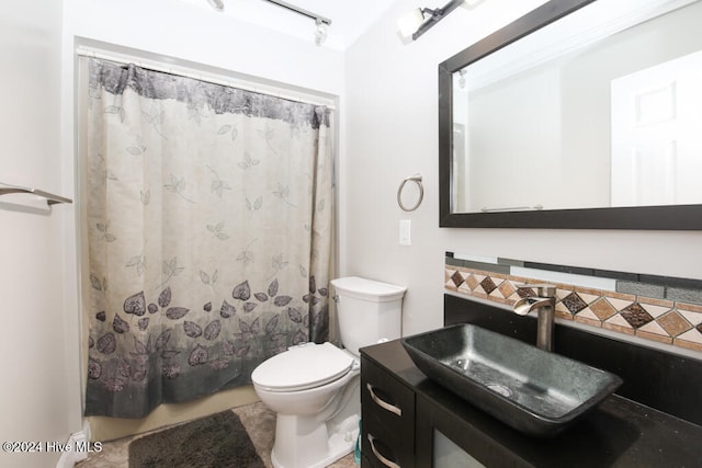 bathroom with tile patterned floors, vanity, toilet, and walk in shower