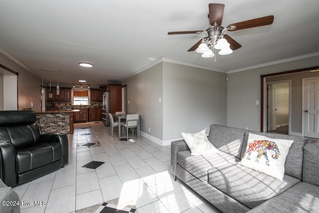 living room with ceiling fan, crown molding, and light tile patterned flooring