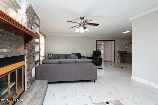 tiled living room with crown molding and ceiling fan