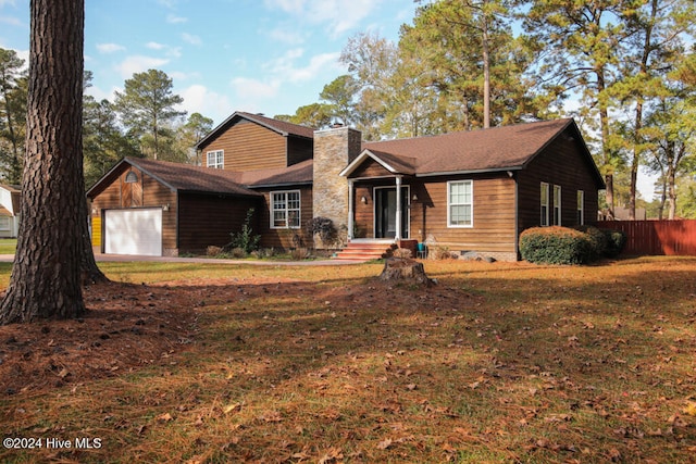 view of front facade with a garage and a front lawn