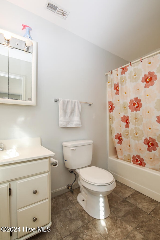 full bathroom featuring shower / bath combination with curtain, vanity, and toilet