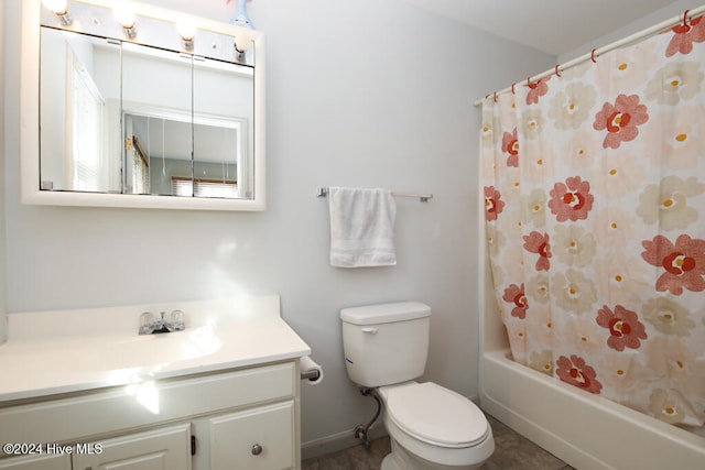 full bathroom with tile patterned flooring, shower / bath combo, vanity, and toilet