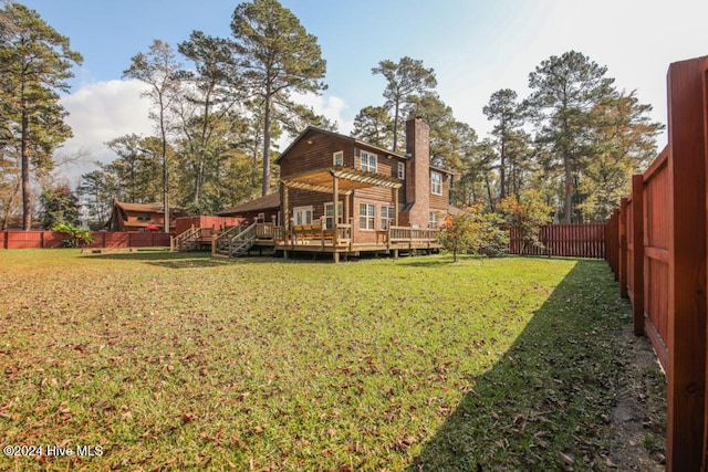 back of property featuring a lawn and a deck