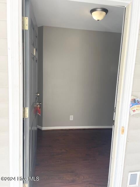 hallway featuring dark hardwood / wood-style floors