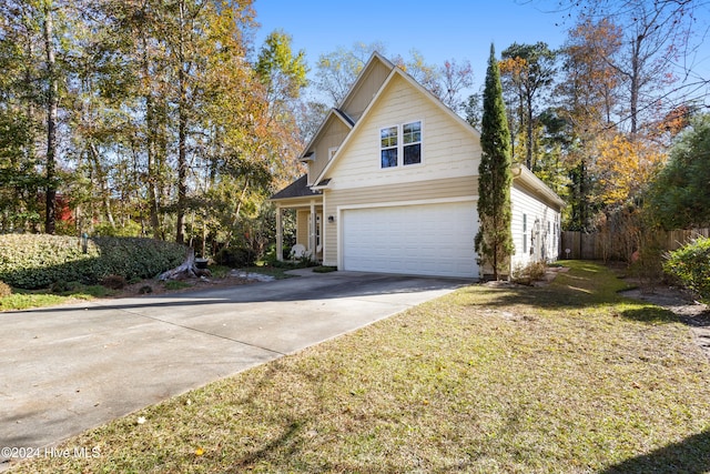 front facade with a front yard and a garage