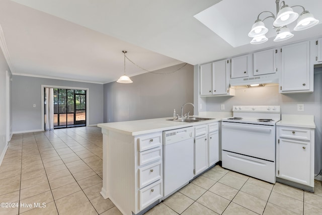 kitchen featuring sink, kitchen peninsula, light tile patterned floors, decorative light fixtures, and white appliances