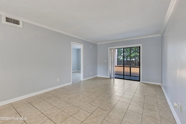 unfurnished room featuring ornamental molding and light tile patterned flooring