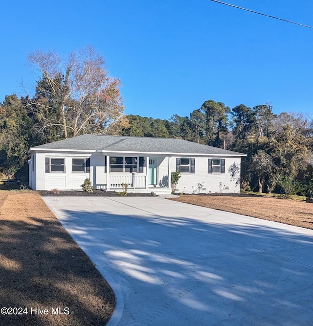 ranch-style house featuring covered porch