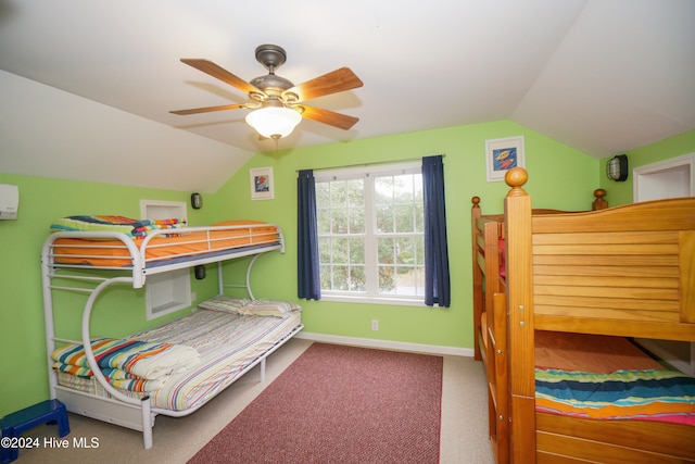 carpeted bedroom featuring ceiling fan and vaulted ceiling