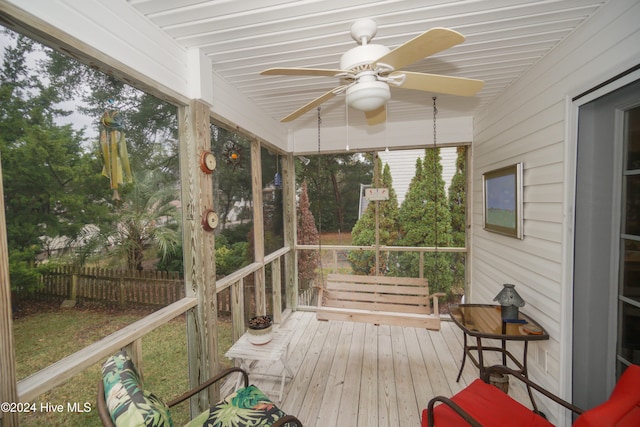 sunroom / solarium featuring ceiling fan