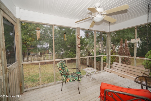 sunroom featuring ceiling fan