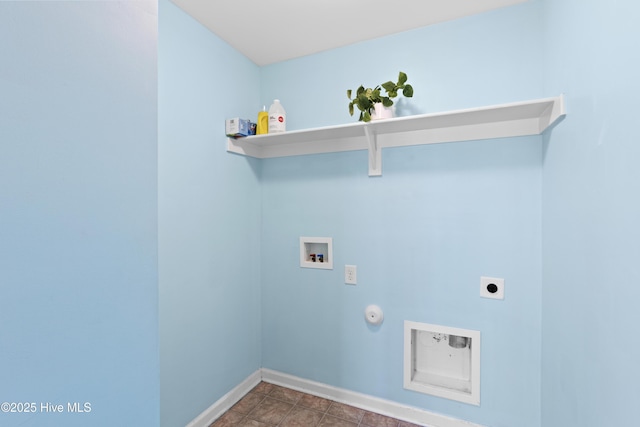 clothes washing area with laundry area, hookup for an electric dryer, gas dryer hookup, baseboards, and hookup for a washing machine